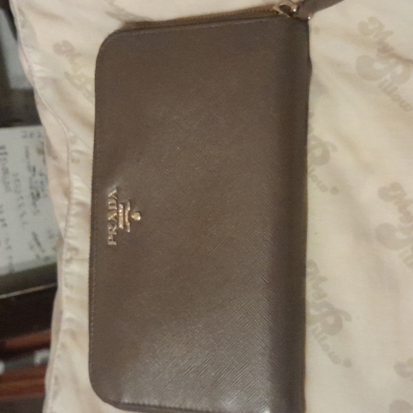 Prada Handbags - Prada zip around brown wallet